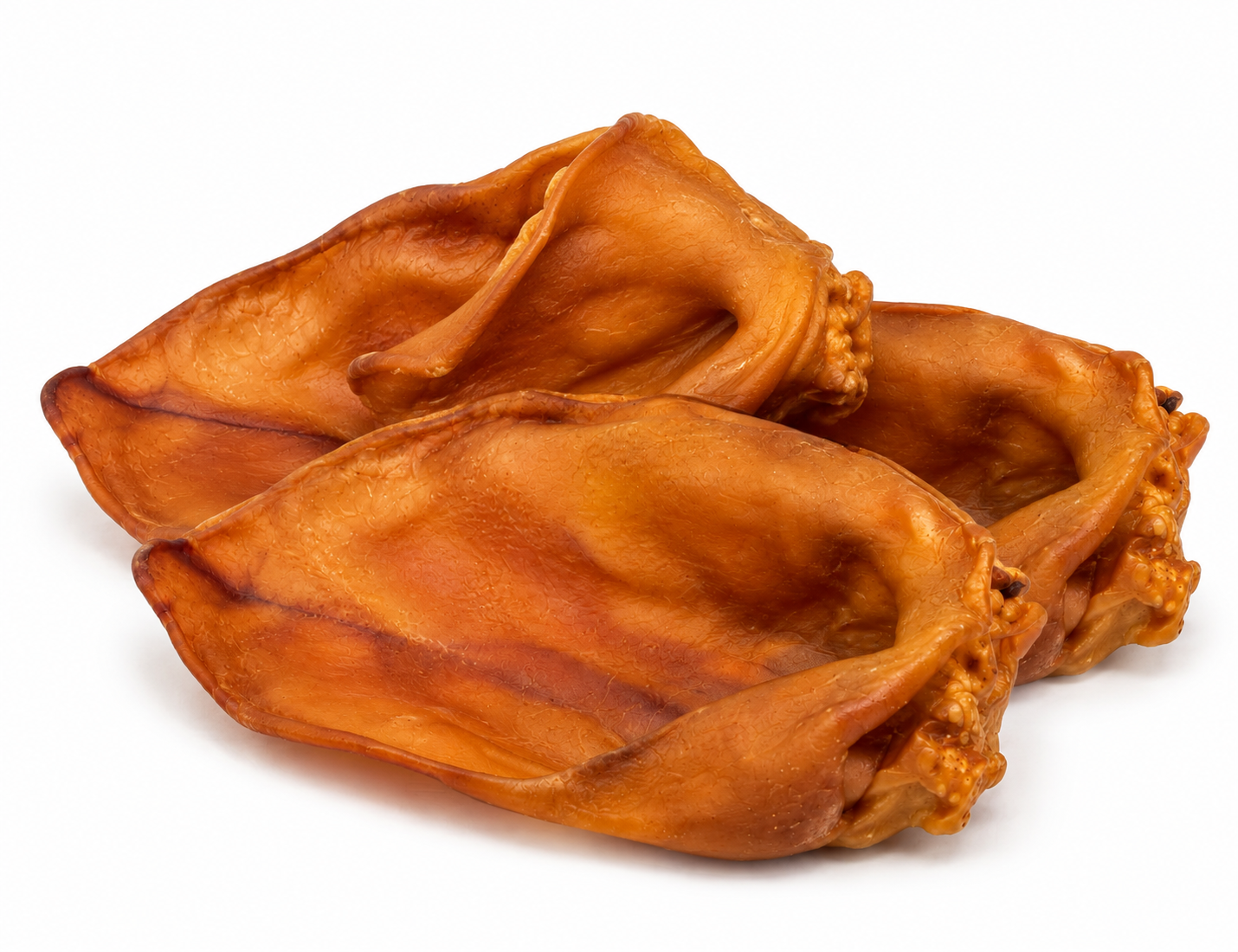 Three air dried, pig ears for dogs arranged on a plain white background.